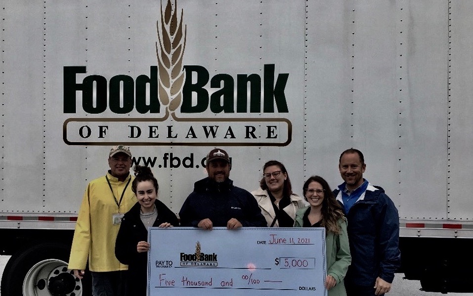 Food Bank of Delaware holding Check from Flagship Credit