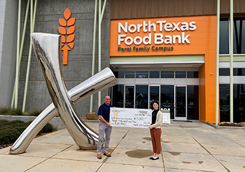 Flagship Presenting a check to North Texas Food Bank