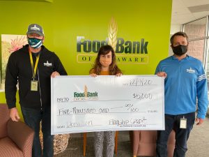 Flagship presents check to Food Bank of Delaware